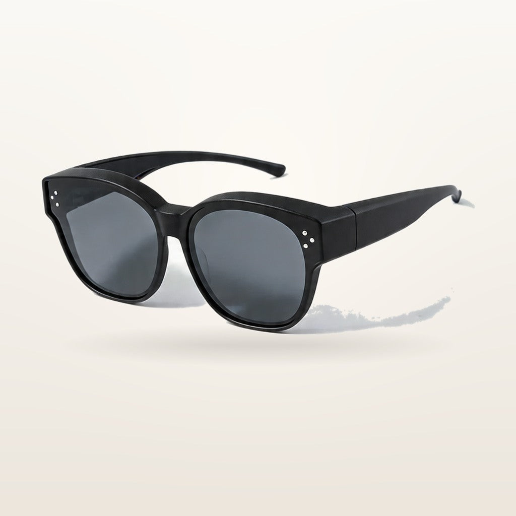 SunFit Kids fit-over sunglasses in black, studio shot on an off-white background