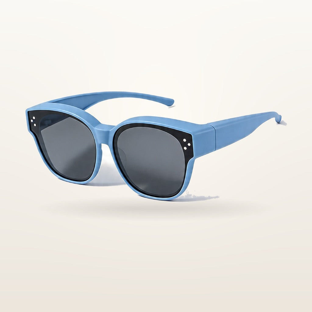 SunFit Kids fit-over sunglasses in blue, studio shot on an off-white background