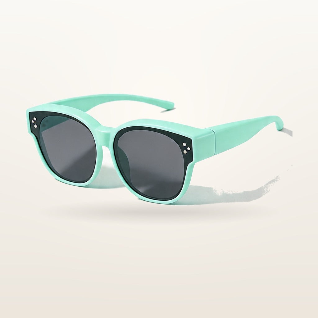 SunFit Kids fit-over sunglasses in neon green, studio shot on an off-white background