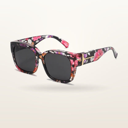SunFit Ladies fit-over sunglasses, Midnight Bloom Cross, studio shot on an off-white background