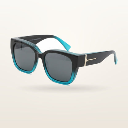 SunFit Ladies fit-over sunglasses, Ocean Turquoise Cross, studio shot on an off-white background