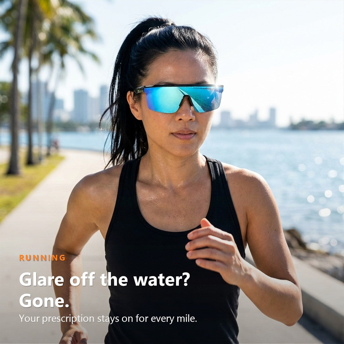 Runner on a waterfront path wearing SunFit Sport Jet Blue over her glasses